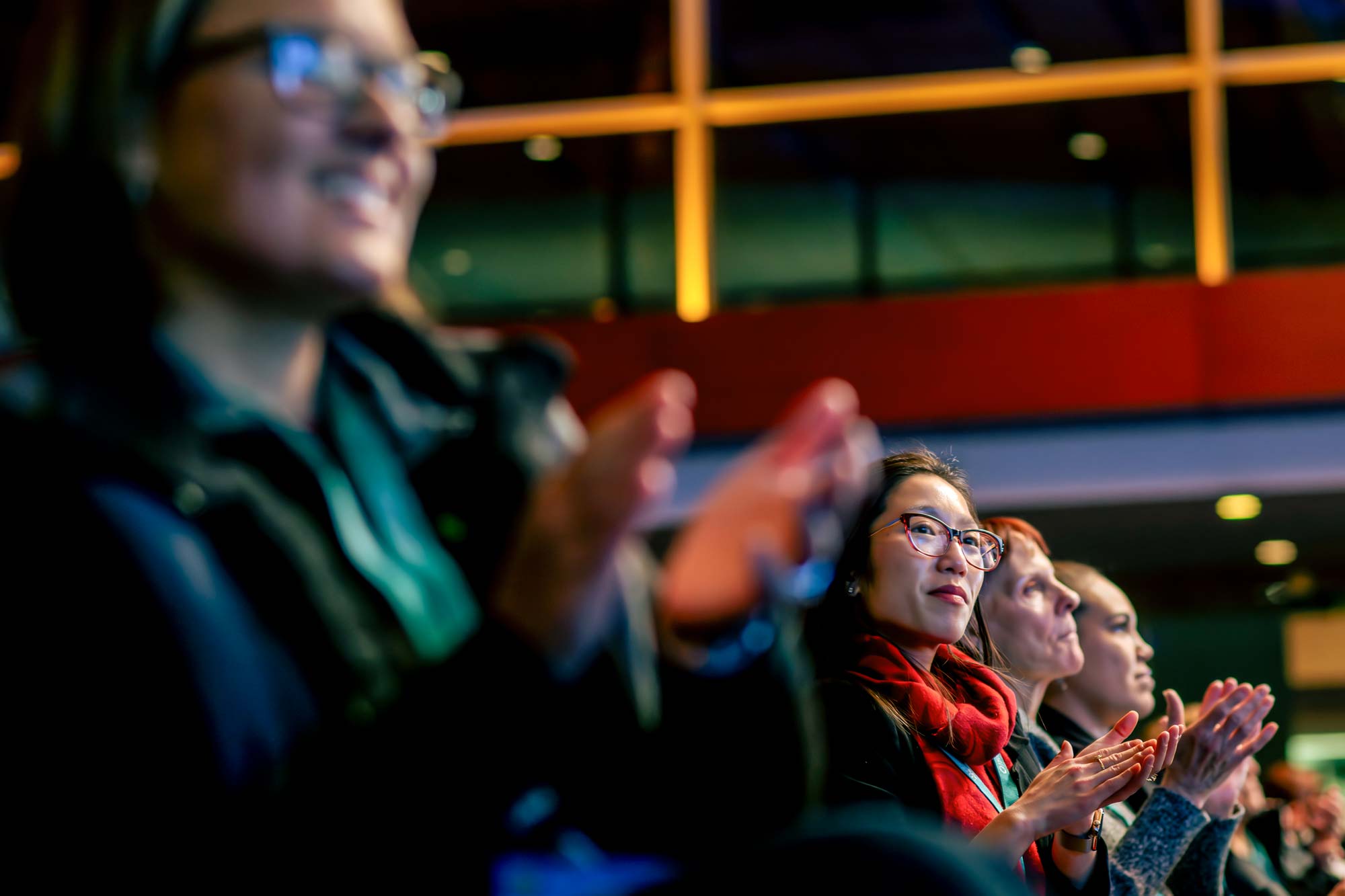 Attendees applauding at a Psych Congress event